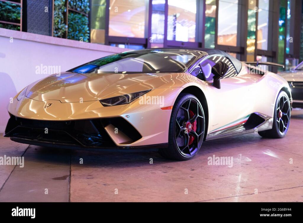 Palm Beach, Florida USA - March 22, 2021: Gold Lamborghini Aventador sport car. front corner view