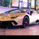 Palm Beach, Florida USA - March 22, 2021: Gold Lamborghini Aventador sport car. front corner view